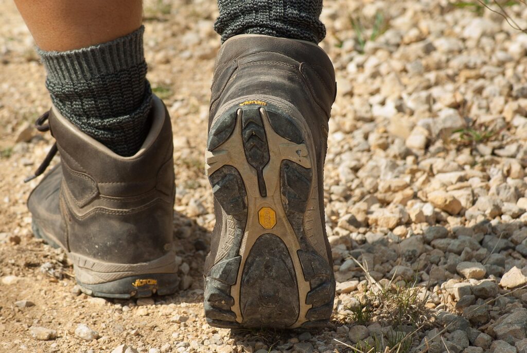 Someone's feet walking in walking boots.