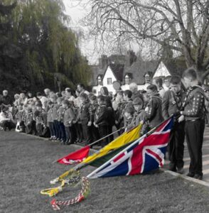 Scout Group on Remembrance Day with flags lowered