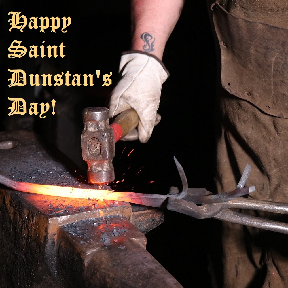 A blacksmith working at an anvil with the words "Happy Saint Dunstan's Day!"