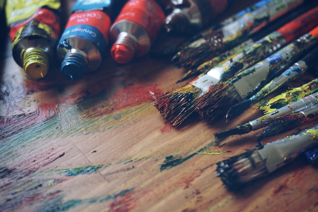 Paint brushes and tubes of paint.